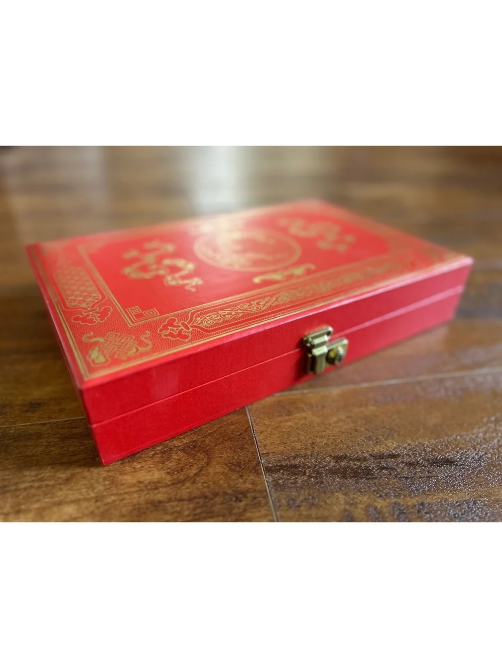 Vintage Red Jewelry Box with Gold Embossed Design and Multiple Compartments